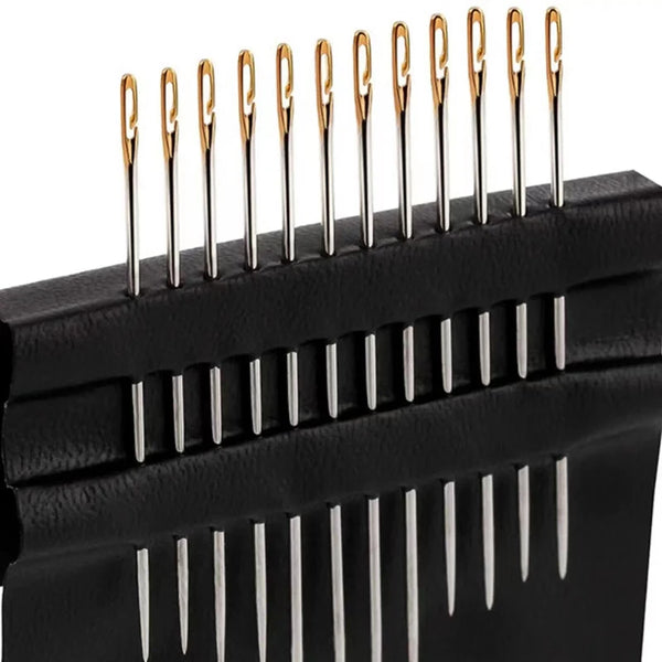 A close-up view of a black sewing needle set with multiple stainless steel needles arranged in rows.