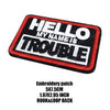 Black and red embroidered patch with white text that reads HELLO MY NAME IS TROUBLE