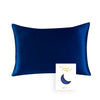 A deep sapphire blue silk pillowcase with a crescent moon design.