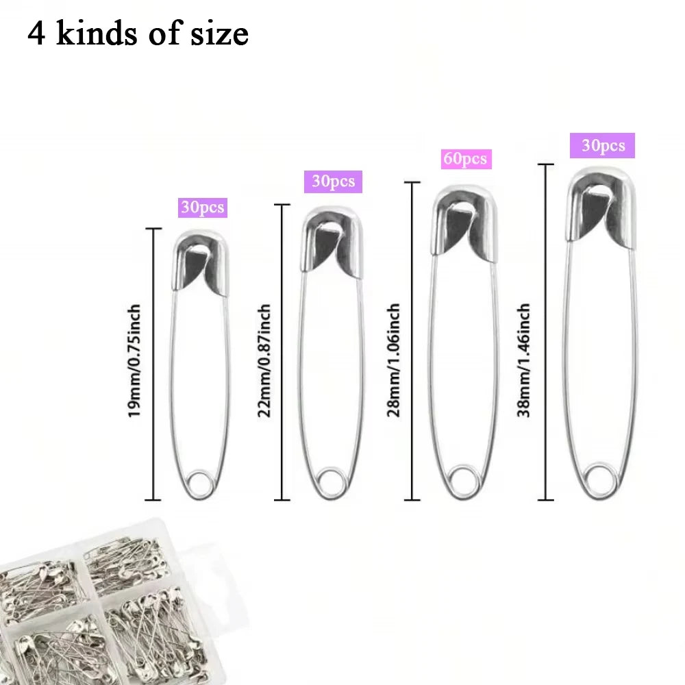 Assorted sizes of stainless steel safety pins shown with corresponding measurements.
