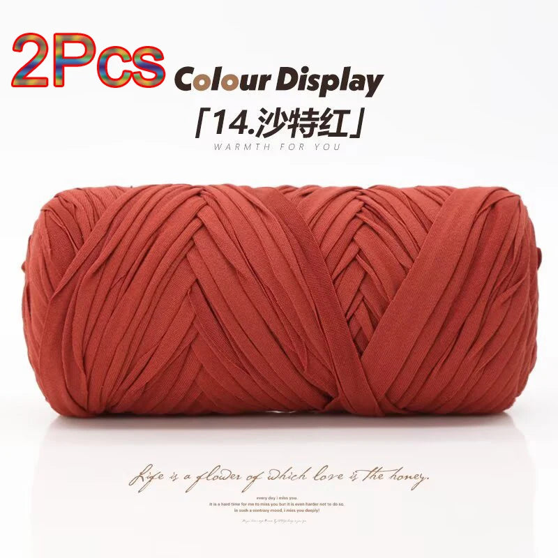 A spool of reddish-orange elastic yarn used for crafting.