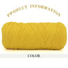 A skein of thick yellow polyester blended yarn is shown rolled up for crafting.