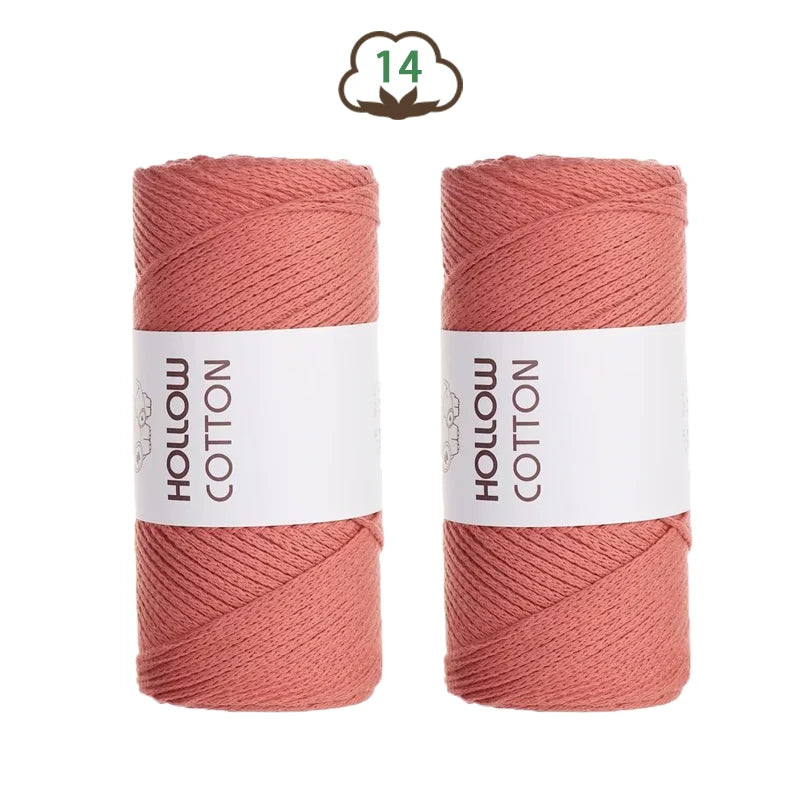 Two spools of pink hand-knitted cotton yarn for DIY crafting