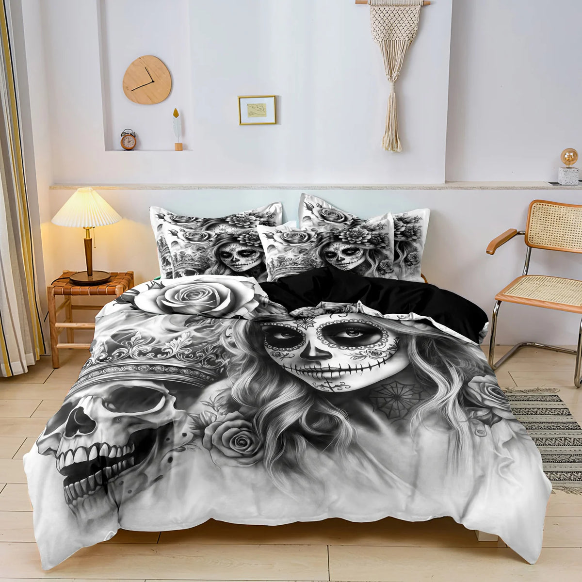 A black and white duvet cover featuring a detailed skull design with roses and swirling hair.