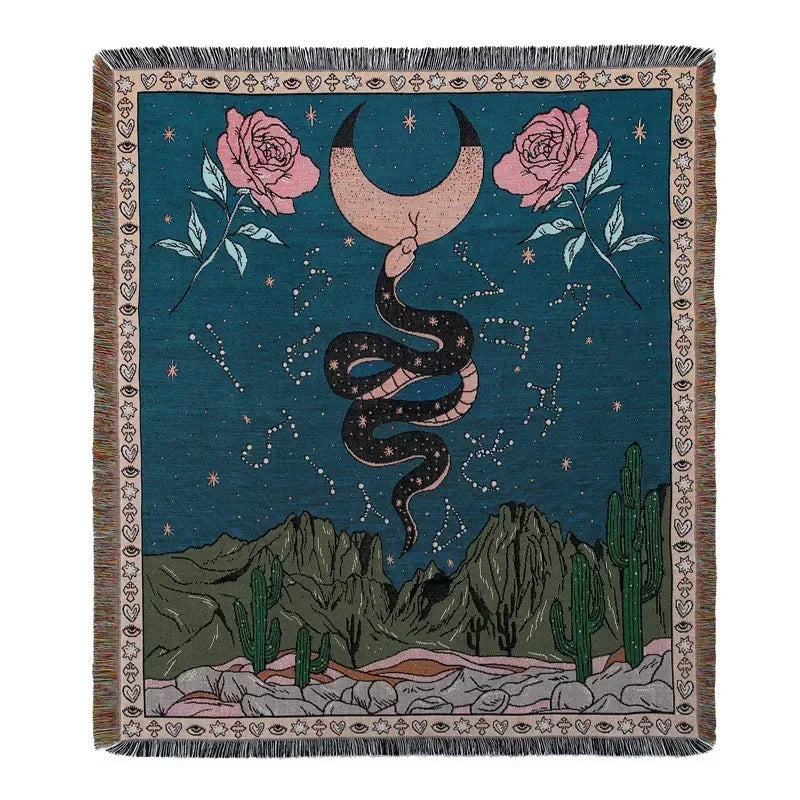 A dark teal throw blanket featuring a starry night scene with pink roses and a black snake against a landscape of green mount