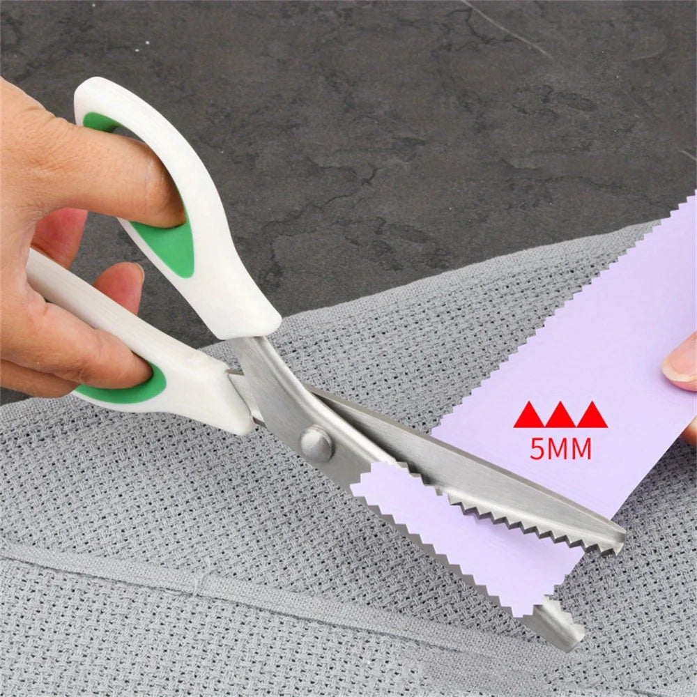 A hand is using professional pinking shears to cut a purple paper strip marked with 5mm measurements.