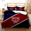A dark blue and maroon duvet cover set featuring the MCM logo design on a bed.