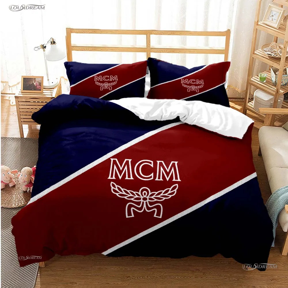 A dark blue and maroon duvet cover set featuring the MCM logo design on a bed.