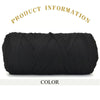 A skein of thick black polyester blended yarn for crafting.