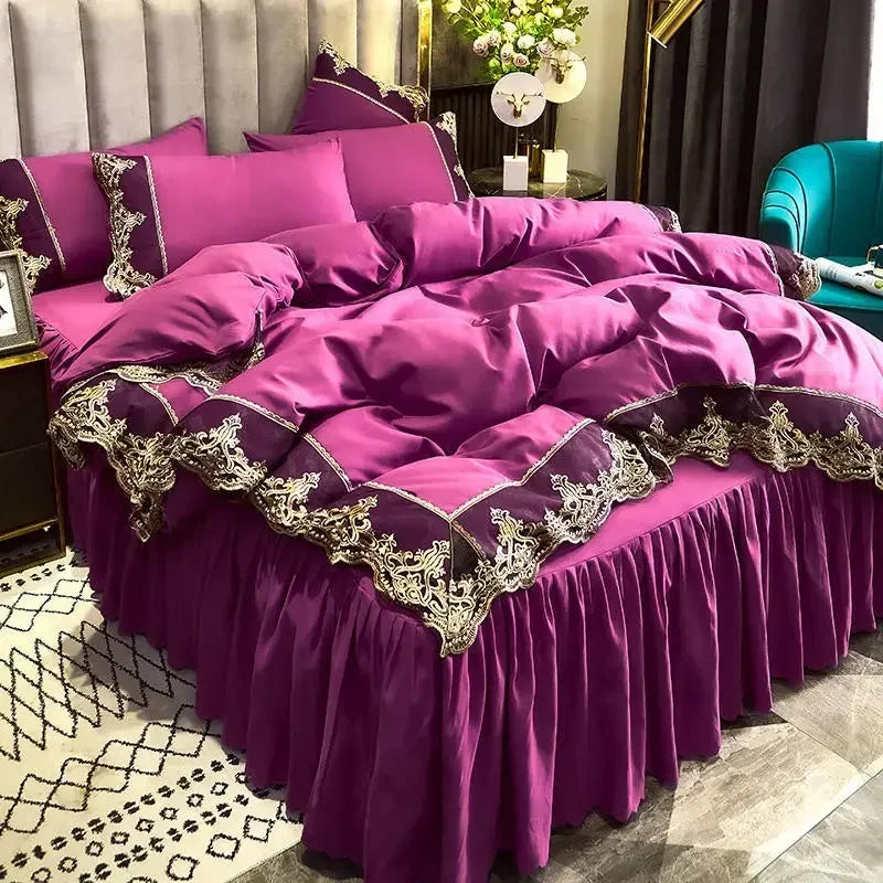 A luxurious purple bed with a ruffled lace edge skirt set and matching pillows in a bedroom setting.