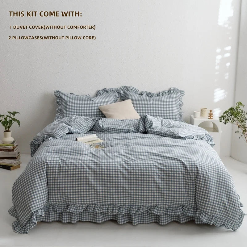 A gray plaid duvet cover set displayed on a bed with pillows and bedding.