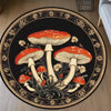 A round carpet featuring a detailed, dark floral pattern with illustrations of various mushrooms in orange and white tones.