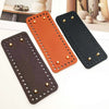 A set of four square woven bag hanging hooks in black and orange colors displayed on a white surface.