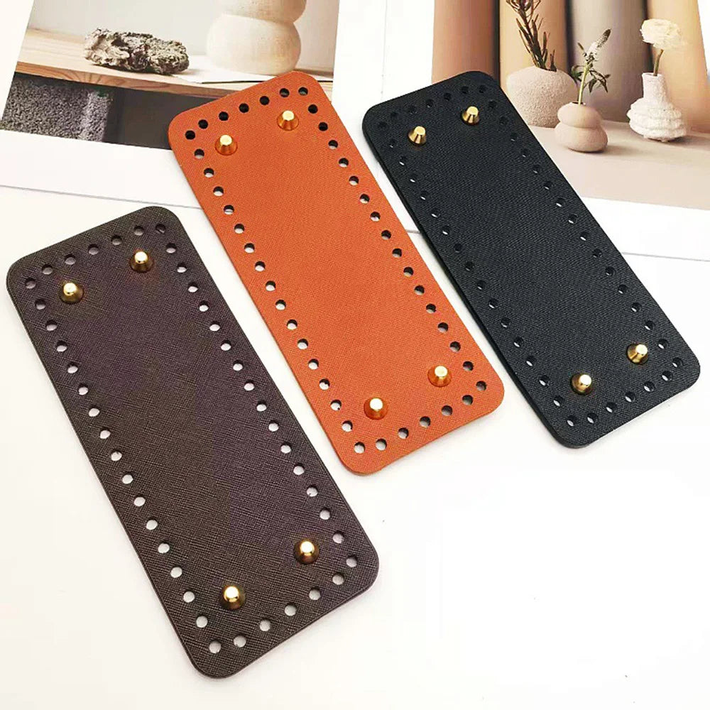 A set of four square woven bag hanging hooks in black and orange colors displayed on a white surface.