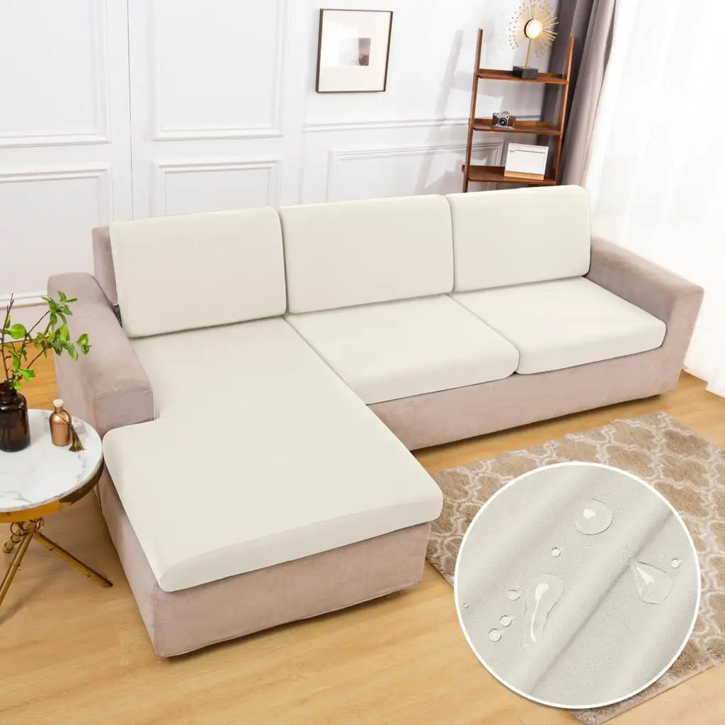 A beige waterproof sofa cushion protector cover is shown on a light gray sofa.