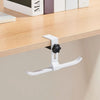 A white adjustable aluminum alloy desk hook with dual clips mounted on a wooden shelf.