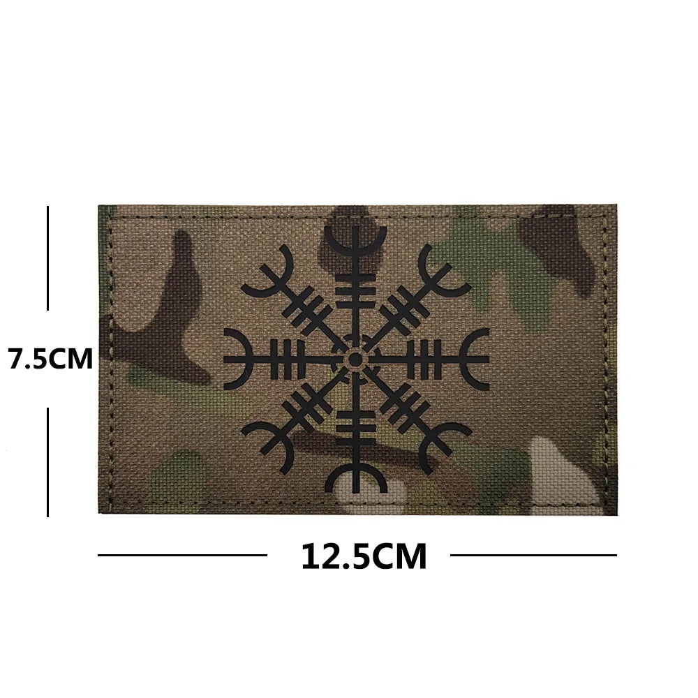 A rectangular camouflage patch featuring an embroidered Valknut design with a hook and loop backing.
