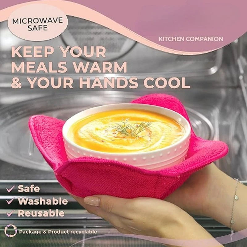 A hand holds a pink quilted silicone bowl cozy containing food in a microwave safe bowl.