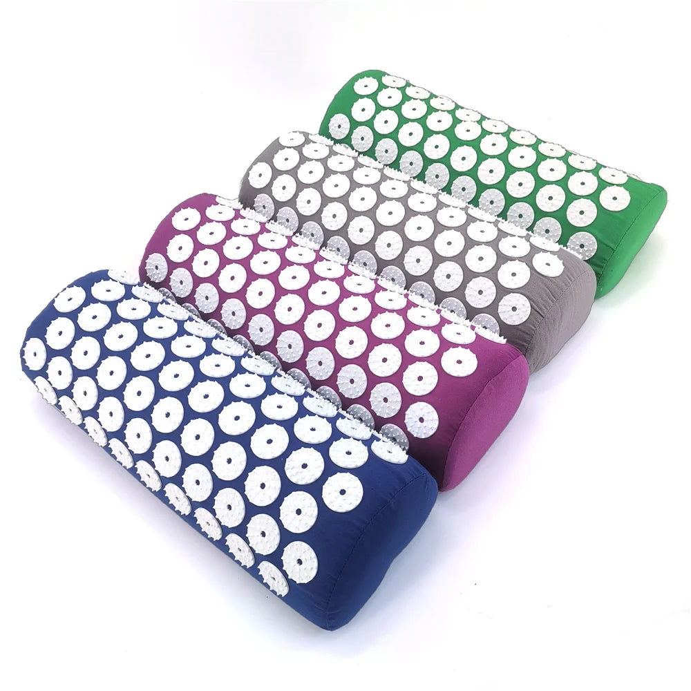 A set of five colored acupressure relief mats and pillows arranged diagonally on a white background.