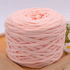 A ball of pink craft yarn made from 100% polyester for knitting and DIY projects.