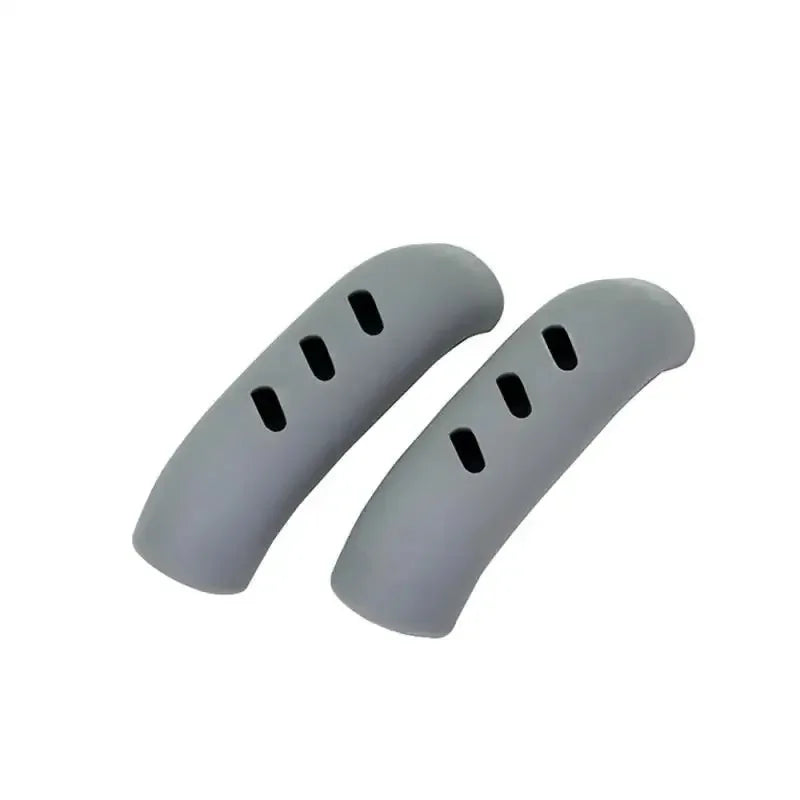 Gray silicone pan handle covers designed to protect heat resistant pot handles.