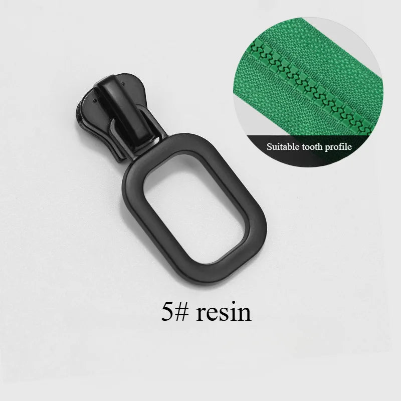 A black resin zipper slider with a green fabric detail is shown against a white background.