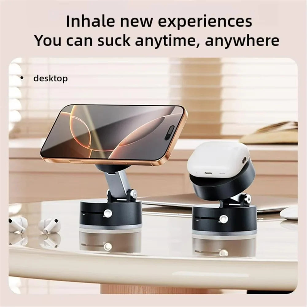 A foldable magnetic phone stand with a vacuum suction base is shown on a desk, displaying a smartphone.