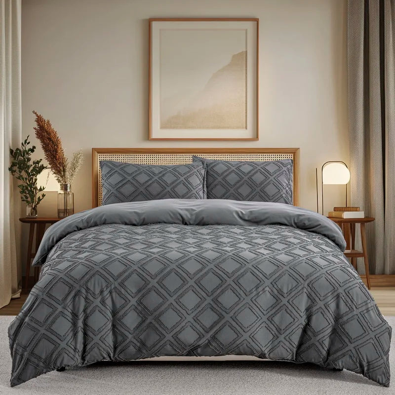 A gray boho tufted microfiber duvet cover set displayed on a bed with a framed artwork.