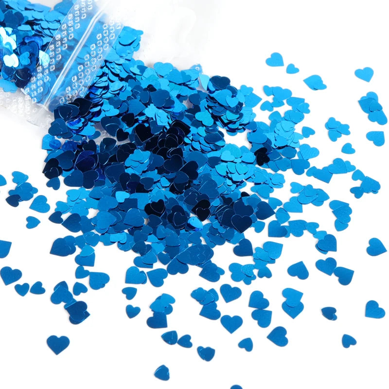 A pile of sparkly blue heart-shaped resin glitter filler for epoxy art.