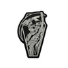 A black and white graphic design of a skull wearing a helmet with goggles, suitable for a biker patch.