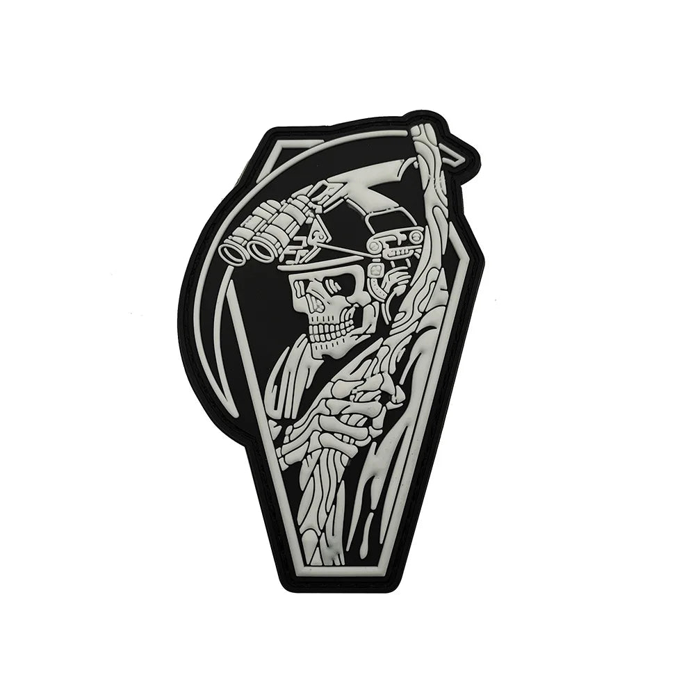 A black and white graphic design of a skull wearing a helmet with goggles, suitable for a biker patch.