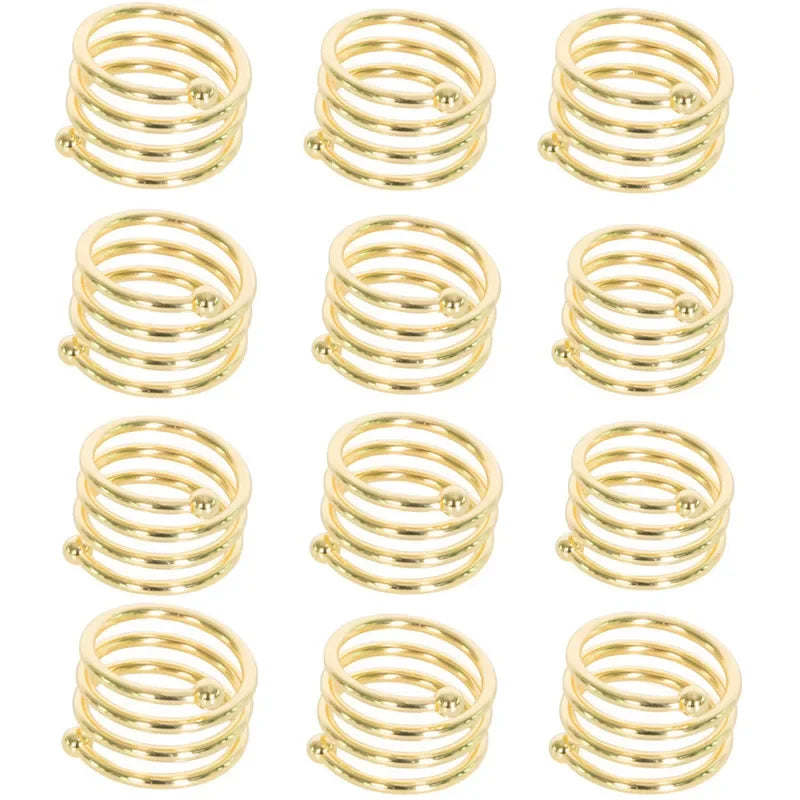 A set of elegant gold metal napkin rings for table decoration.