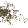 A pile of brass colored safety bulb pins for knitting and sewing.