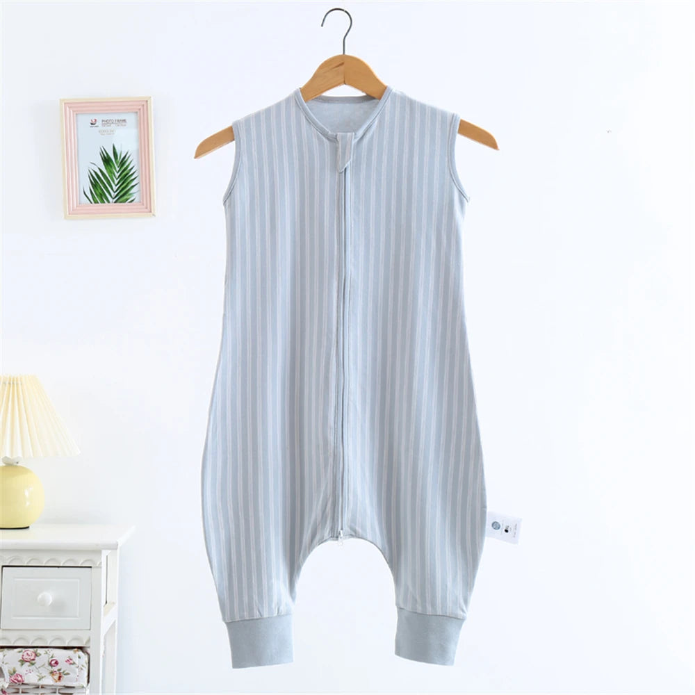 A light blue and white striped cotton sleeping bag for children hanging on a wooden hanger.