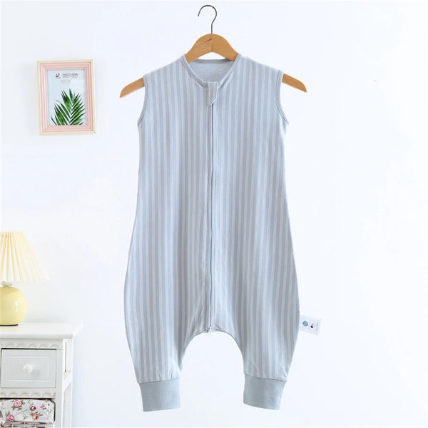 A light blue and white striped cotton sleeping bag for children hanging on a wooden hanger.