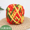 A ball of red, yellow, and green chenille knitting yarn for hand crafting.
