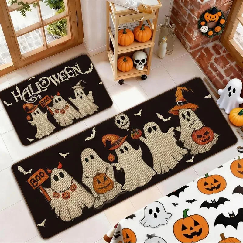 A set of Halloween ghost and pumpkin print non-slip kitchen rugs displayed on a floor.