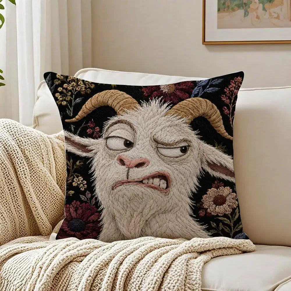 A decorative pillow featuring a realistic, screaming goat face in gray and black tones.