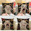 A close-up of a funny screaming goat linen cushion cover with expressive facial features and dark floral patterns.