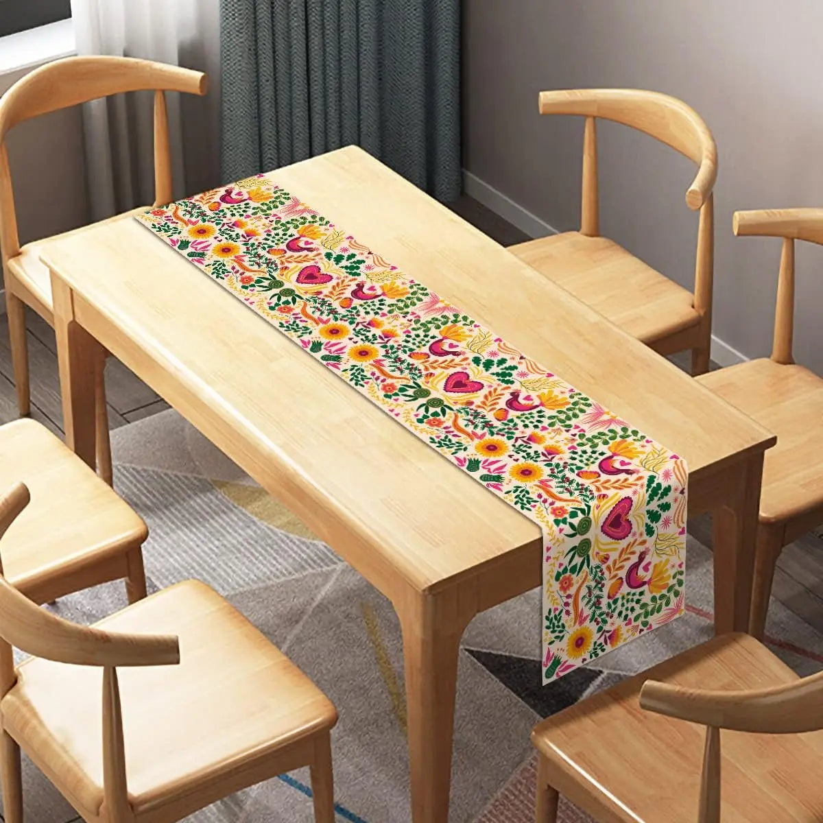 A light wood dining table set with a colorful Day of the Dead linen table runner.