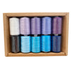 A box containing ten colorful polyester sewing thread spools in various shades of purple and blue.