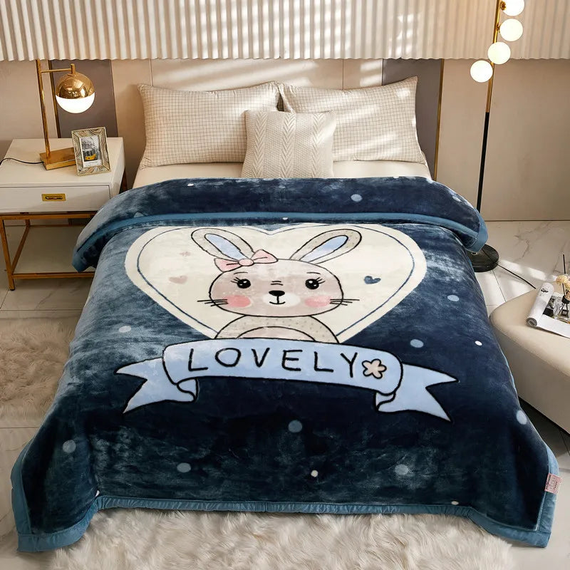 A dark blue plush fleece blanket featuring a white rabbit design and the word LOVELY embroidered on it.