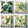 A set of four decorative pillowcases featuring botanical leaf prints in shades of green and gold on a cream background.
