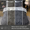 Three variations of a dark gray floral print duvet cover and pillowcase set shown under dim, warm, cold, and natural light.