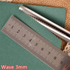 Stainless steel pinking shears shown next to a ruler measuring 10 centimeters.
