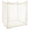 A sheer, beige mosquito net canopy draped over a bed frame.