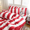 A red and white striped duvet cover set displayed on a bed with white blinds.