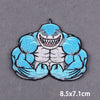 A blue and gray embroidered patch featuring a fierce, muscular dragon face.