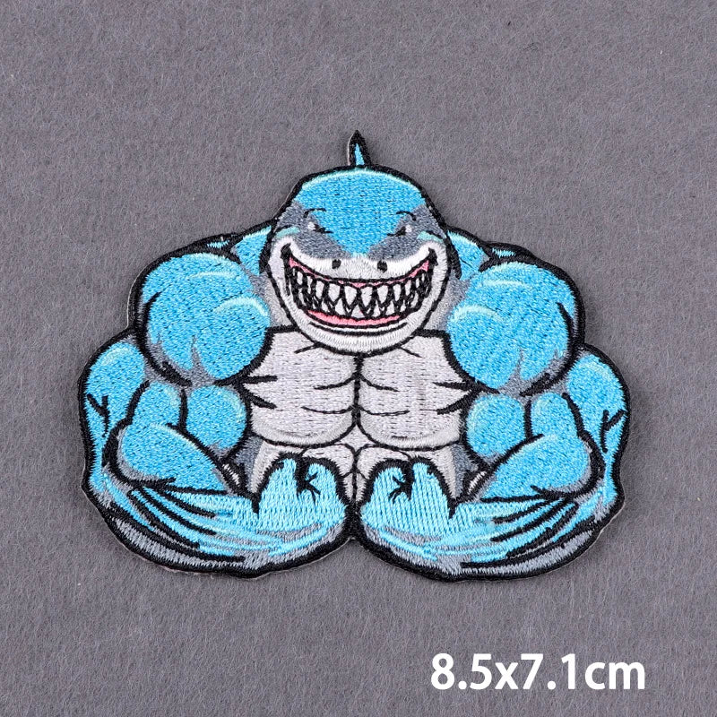 A blue and gray embroidered patch featuring a fierce, muscular dragon face.