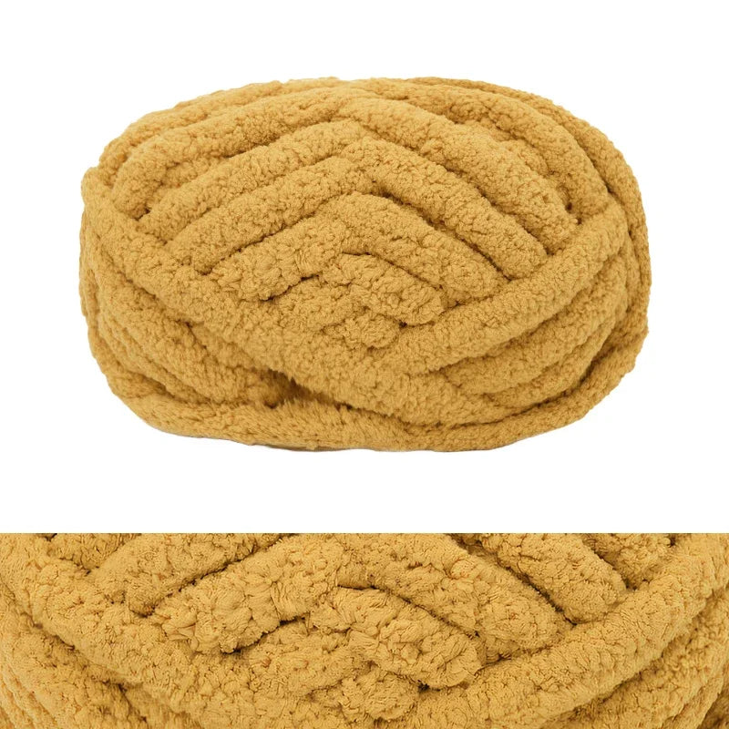 A ball of hand-knitted wool finger line scarf in a light tan or beige color.